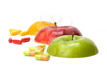 sliced fruits and pills isolated on white background
