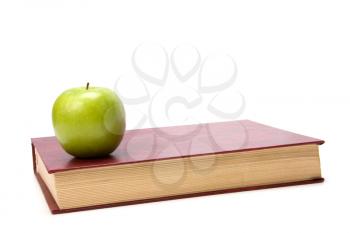 book with apple isolated on white background