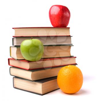 book stack with fruits isolated on white background