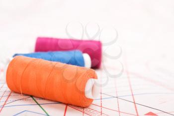 Spool of thread. Sew accessories on blurred background