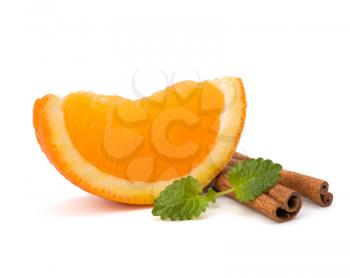 Orange fruit segment, cinnamon sticks and mint isolated on white background. Hot drinks ingredients.