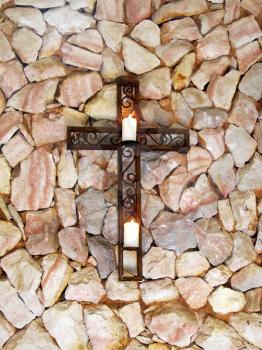 Royalty Free Photo of a Mounted Cross With Candles