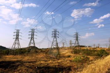 Royalty Free Photo of Large Power Cable Towers Running Through Rural Area