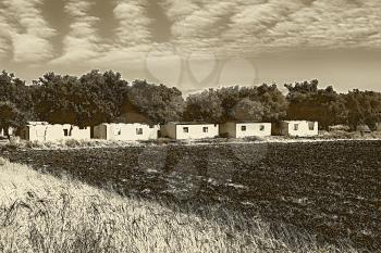 Sepia Toned Black and White Illustration Ruins of Farm Workers Houses