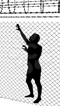 Silhouette of a teenager trying to escape from wired enclosure