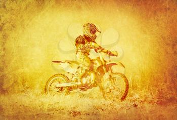 Artistic Image of Off-Road Motorbike Racer Super imposed on Grunge Earthly Background