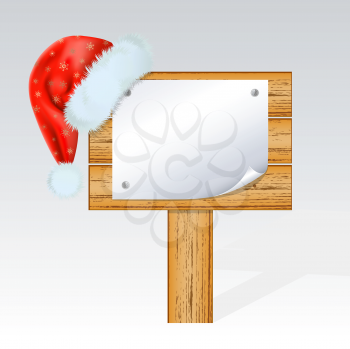 Royalty Free Clipart Image of a Santa Hat on a Sign