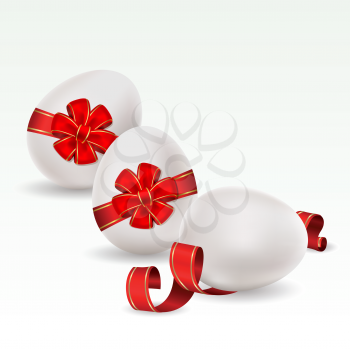 Royalty Free Clipart Image of Eggs With Red Bows