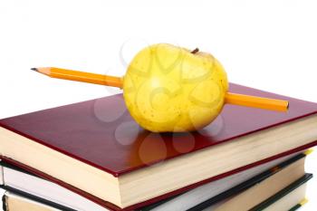books are an apple and pencil isolated on white background