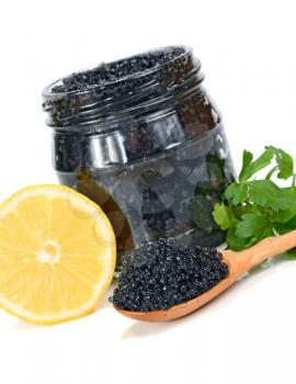 caviar black in a glass jar with lemon and parsley isolated on white background