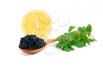 caviar black is in a wooden spoon isolated on white background