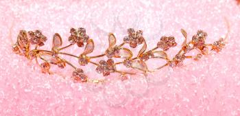 elegance gold diadem on pink background