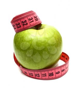 green apple and measuring ribbon for diet isolated on white background