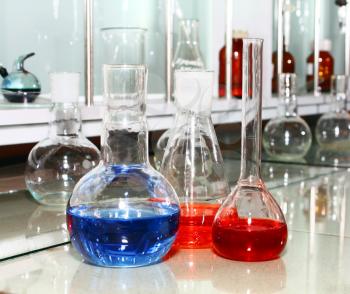 laboratory beakers with the coloured liquid