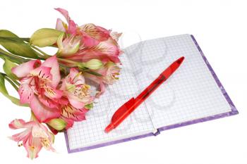 notebook with a pen and flowers isolated on white background