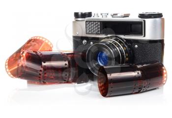 old retro photo camera and film isolated on white background
