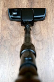 black tube and brush vacuum cleaner