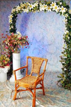 wooden arm-chair and decorative pattern of flowers