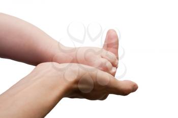 Photo of baby foot on his mother?s palm in isolation 