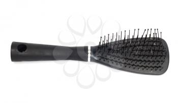 Hairbrush, comb on bright background