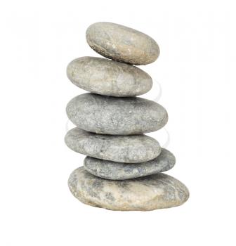 A stack of slightly off-balanced zen stones isolated on white background. 