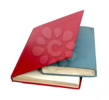 closed red and blue books on a reflecting white background 
