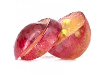 Translucent slice of red grape fruit, macro isolated on white 