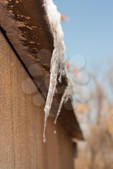 ice on a rusty metal roof
