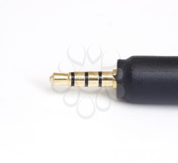 Mini Jack Plug with roll of wire isolated on white background 
