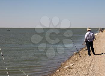 Fisherman fishing on the lake