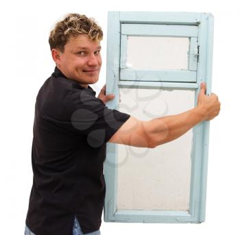 man holding an old window on a white background
