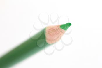 green pencil on white background. macro