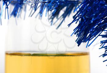 champagne with blue tinsel on a white background