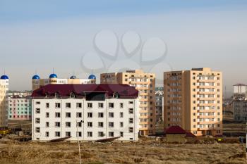 Not completed houses and tower crane in Kazakhstan. Shymkent