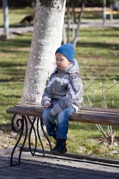 boy in a blue cap on nature