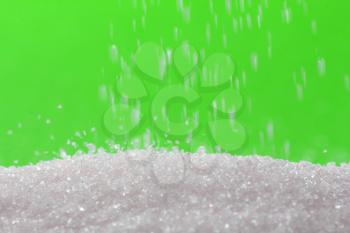 sugar on a green background. macro