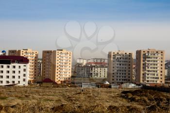 Not completed houses and tower crane in Kazakhstan. Shymkent