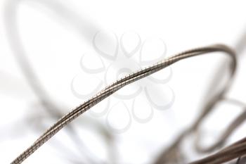 old metal strings on a white background