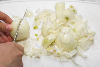 chopped onion with a knife