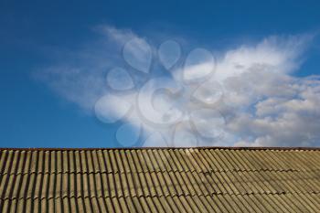 background of the roof and the sky with clouds