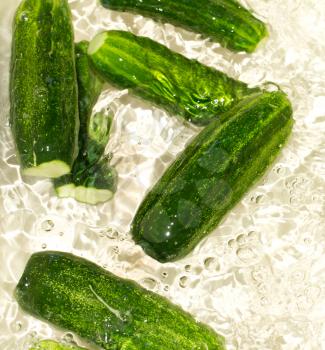 cucumbers in the water as a background