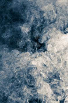 abstract background of blue smoke on a black background