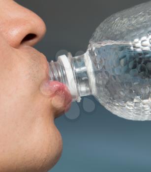 drink water from a bottle macro