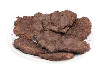 cutlets of liver on a white background .
