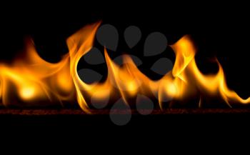 Strip of fire on a black background .