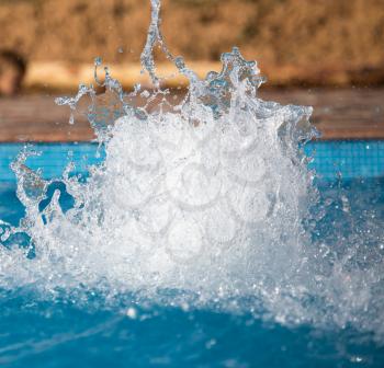Splashing water in the pool as a background .