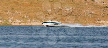 Boat floats on the lake speed