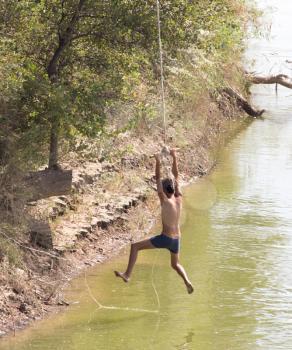 man on the bungee on the river