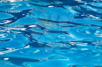 The smooth water in the pool as a background .