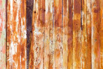 Old rusty metal fence as an abstract background .